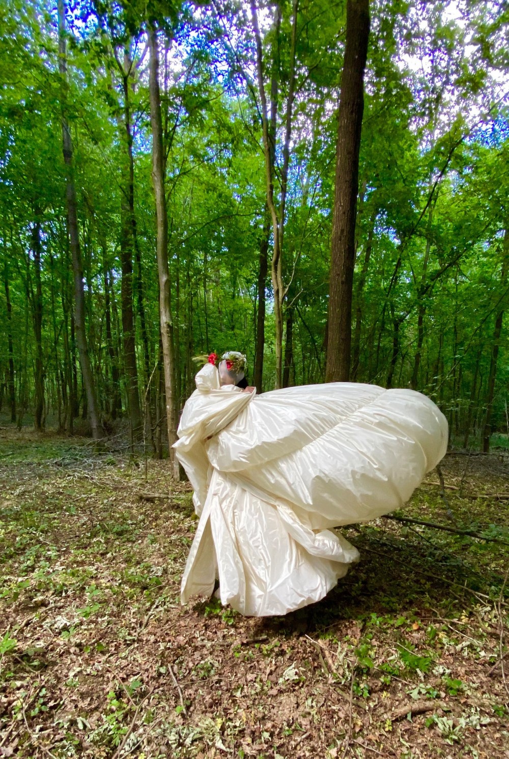 Image may contain Clothing Apparel Plant Tree Fashion Gown Female Robe Vegetation and Woman