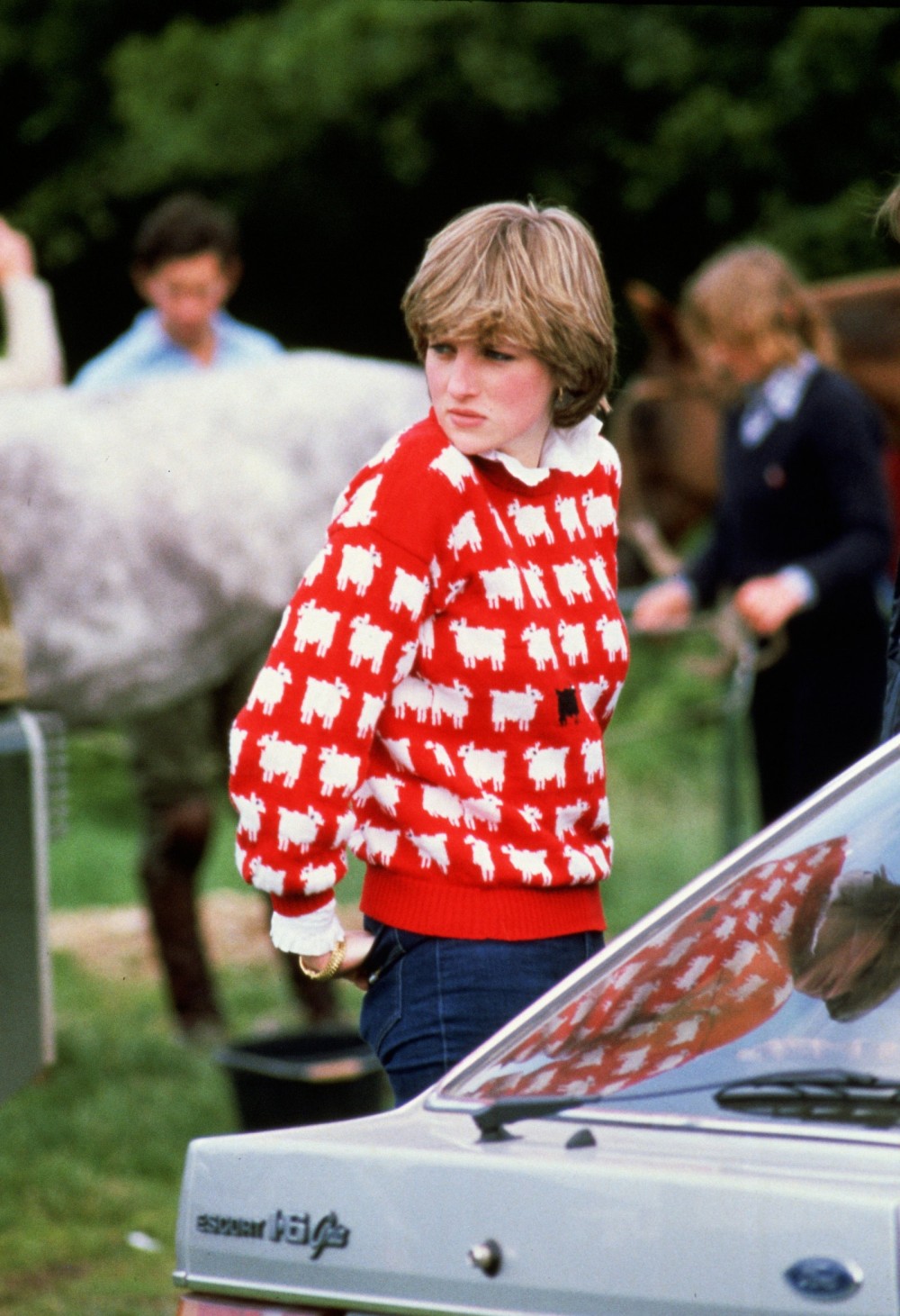 Princess Diana wearing 'Black sheep' sweater by Warm and Wonderful to a polo match in 1980.