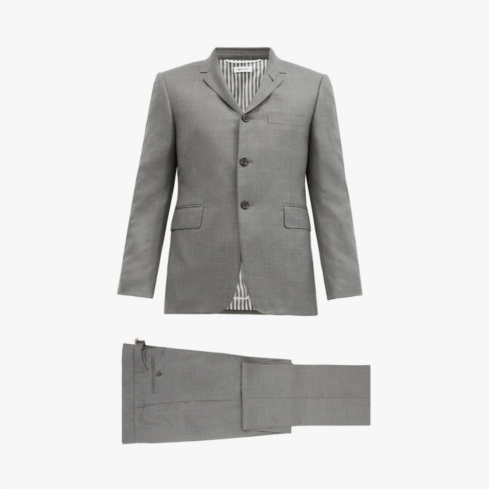Image may contain: Clothing, Apparel, Suit, Coat, Overcoat, Jacket, Blazer, and Tuxedo