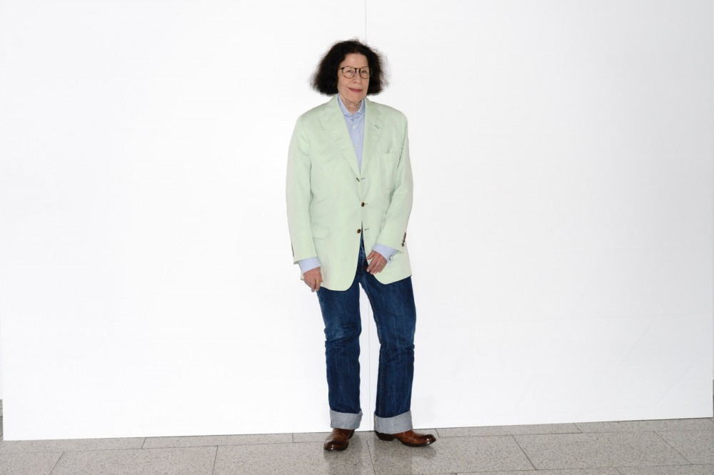 Image may contain Clothing Apparel Jacket Coat Blazer Fran Lebowitz Pants Human Person Suit Overcoat and Denim