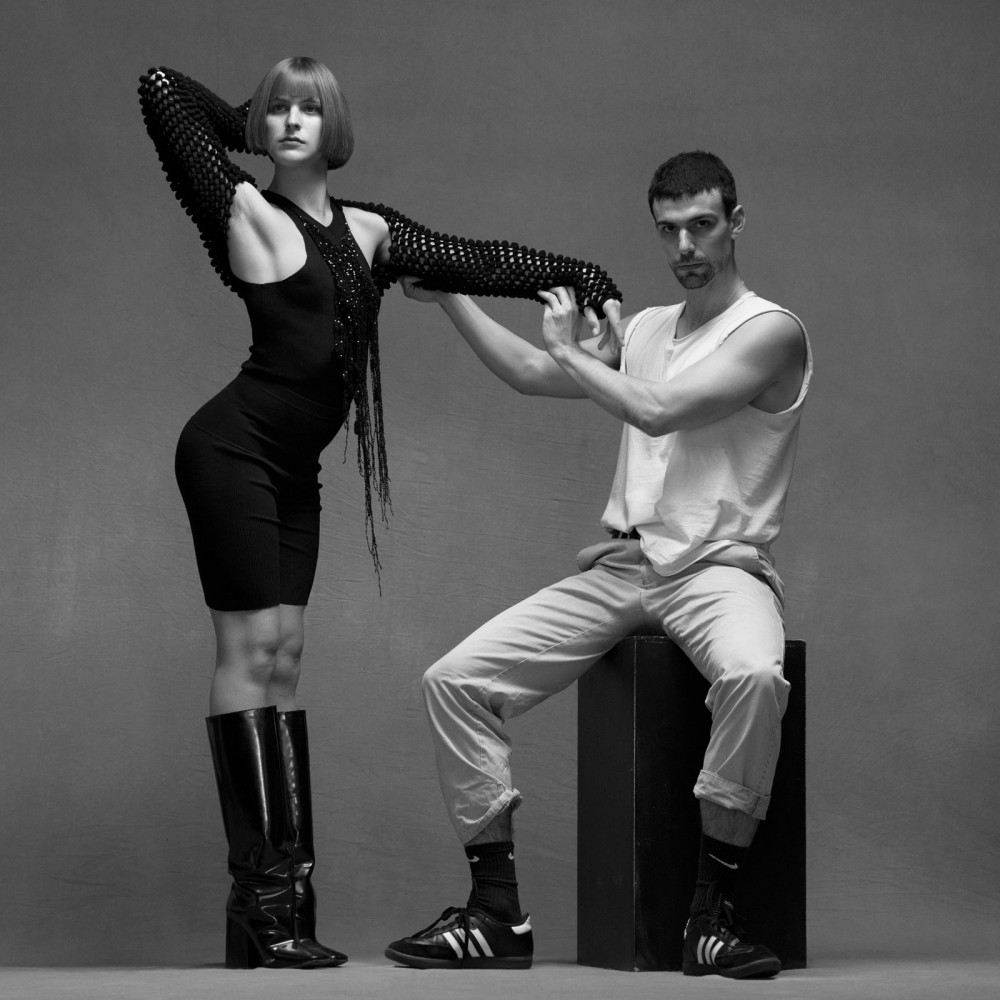 Designer Conley Averett with model Marcs Goldberg wearing a Judy Turner shrug  tank top  and shorts  judyturner.com....