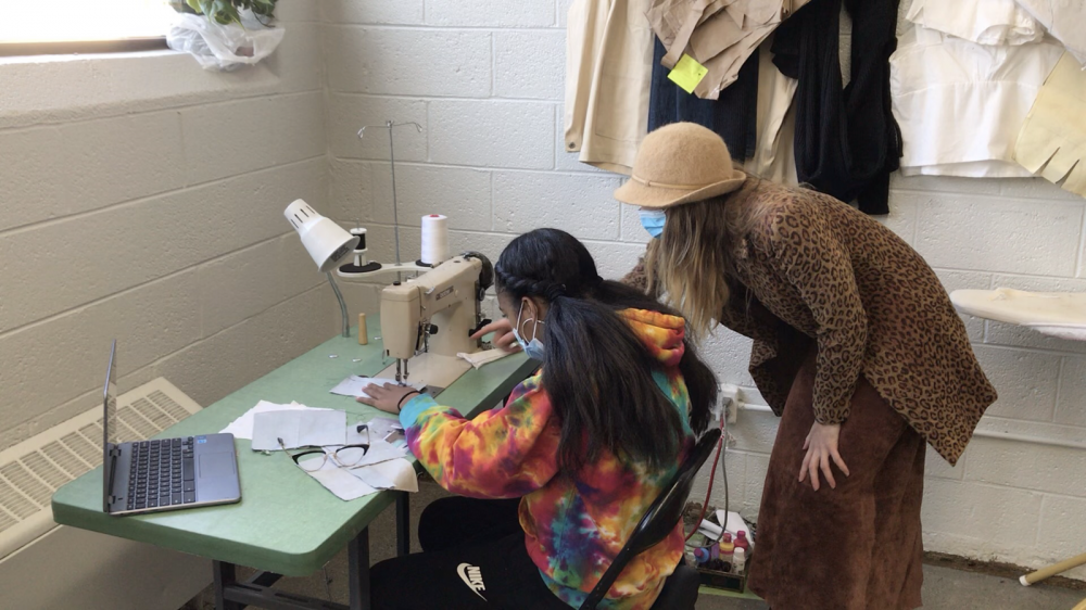 Kelsey Tucker teaching Detroit youth how to sew