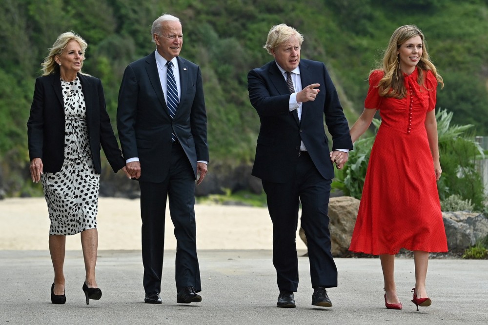 British Prime Minister Boris Johnson and his wife Carrie Johnson walk with U.S. President Joe Biden and First Lady Jill...